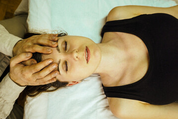 Woman receiving craniosacral therapy